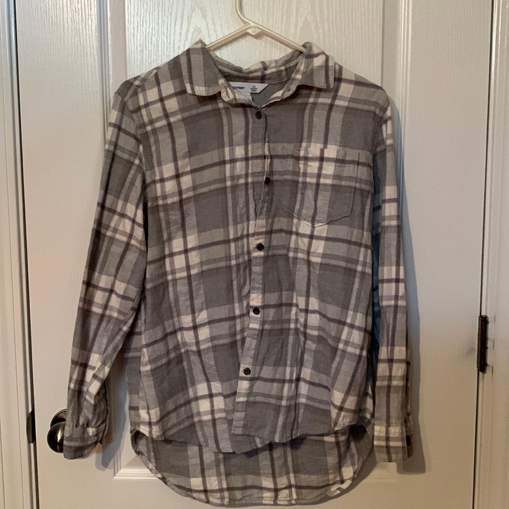 Grey button up shirt and is a large.